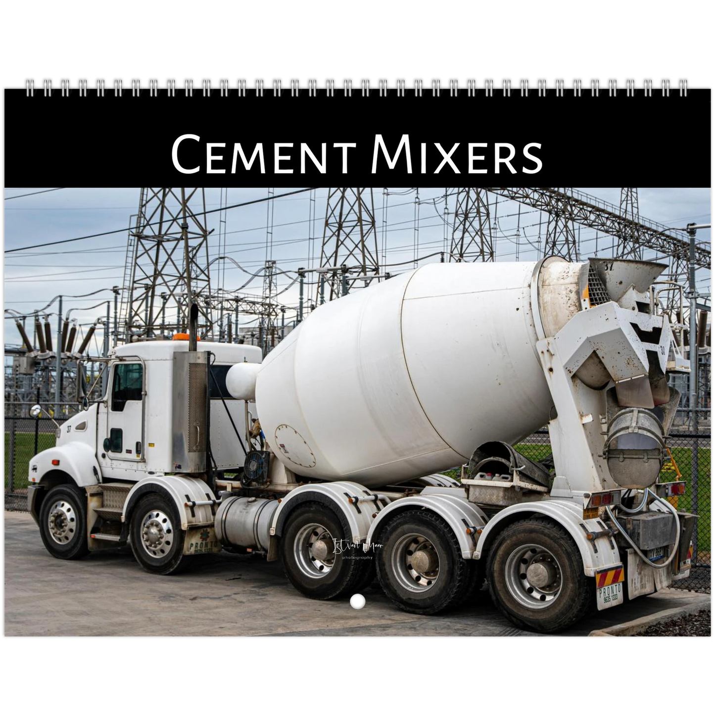 A spiral-bound wall calendar or print featuring a large white cement mixer truck in an industrial outdoor setting, with a black header at the top reading 'Cement Mixers'.