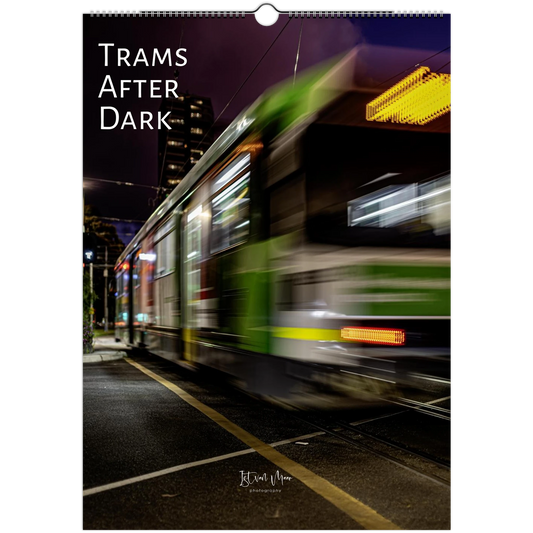 Trams After Dark wall calendar cover featuring a green Melbourne tram in dramatic motion blur at night with tram tracks and city lights - night photography by Istvan Maar