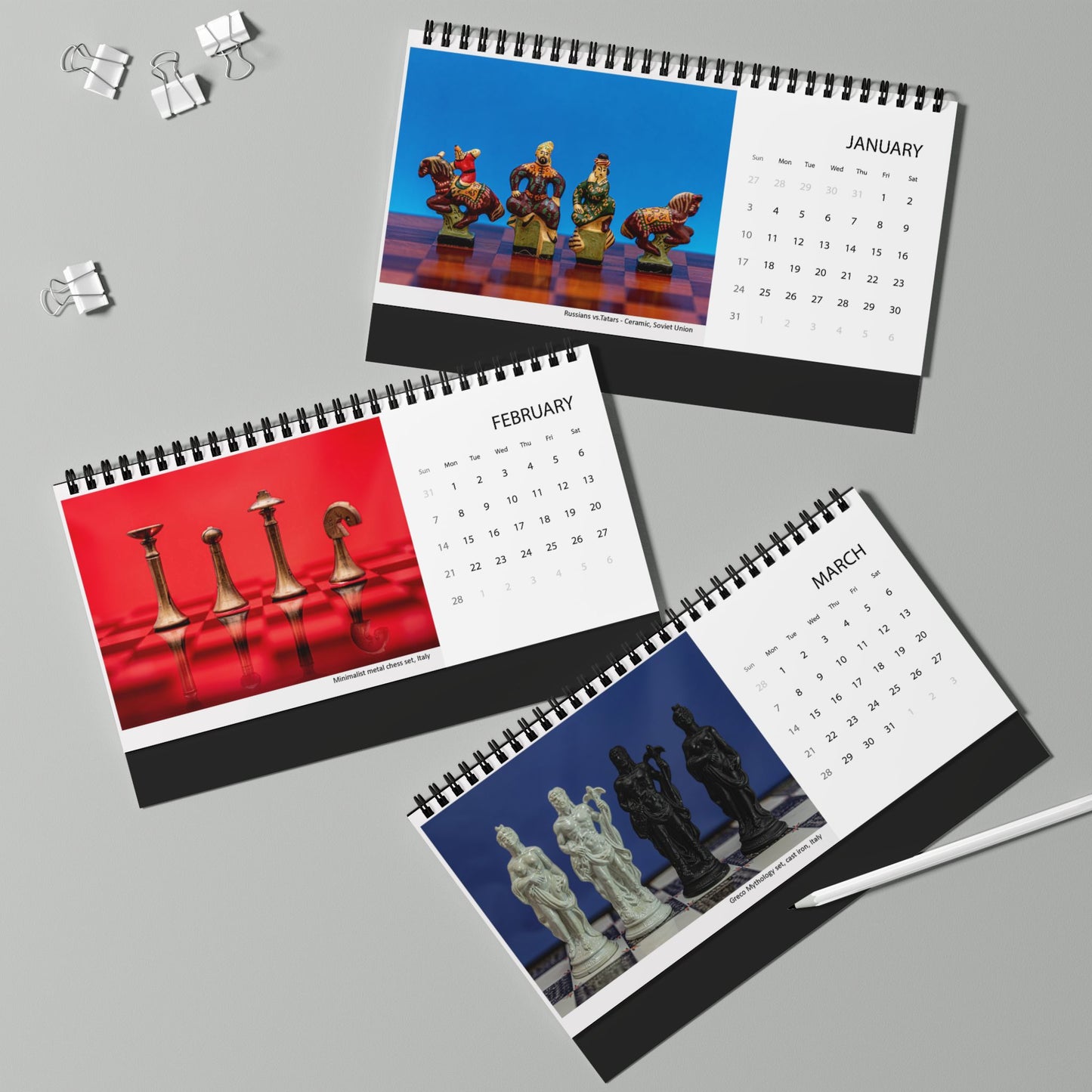 Three spiral-bound desk calendars for January, February, and March are arranged on a light gray background. Each calendar features a chess-themed cover with chess pieces on a red or blue surface.