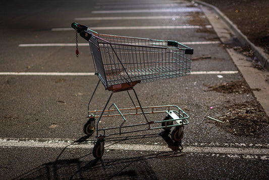 Lone shopping trolley in an empty car park at night, from the Urban Trolley Wall Calendar, a quirky Secret Santa gift