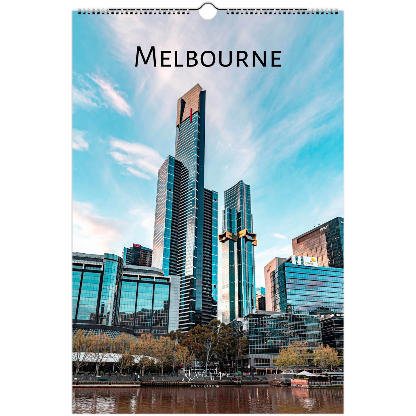 A hanging wall calendar featuring a photograph of the Melbourne skyline with prominent skyscrapers, water in the foreground, and the word "MELBOURNE" printed at the top.
