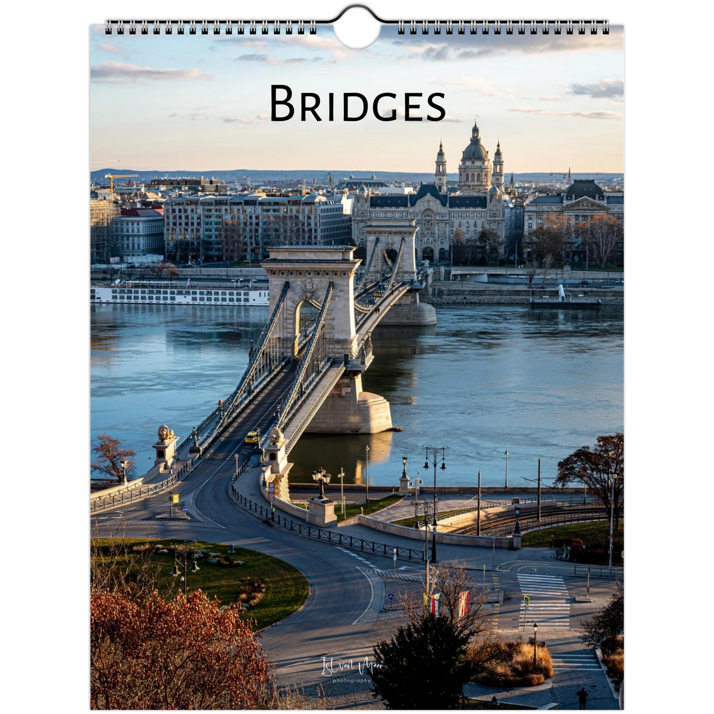 A spiral-bound wall calendar page featuring a scenic photograph of the Chain Bridge over the Danube River in Budapest, with the word 'BRIDGES' printed at the top.