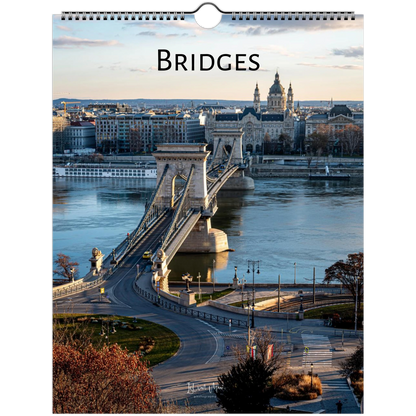 A spiral-bound wall calendar page featuring a scenic photograph of the Chain Bridge over the Danube River in Budapest, with the word 'BRIDGES' printed at the top.