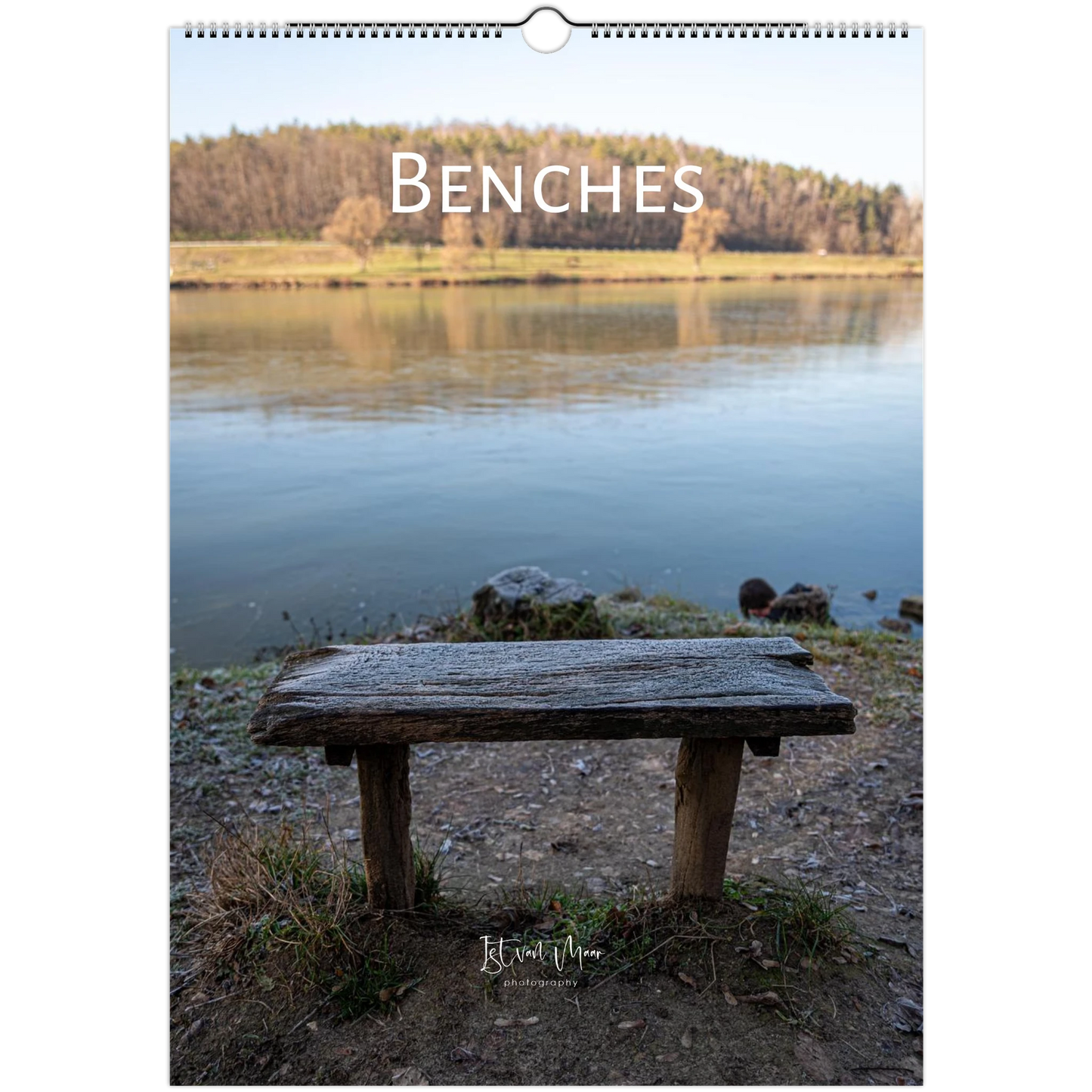 Calendar cover with a bench by a lake and the word 'BENCHES'.