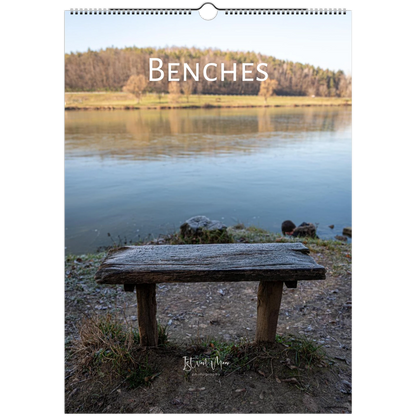 Calendar cover with a bench by a lake and the word 'BENCHES'.