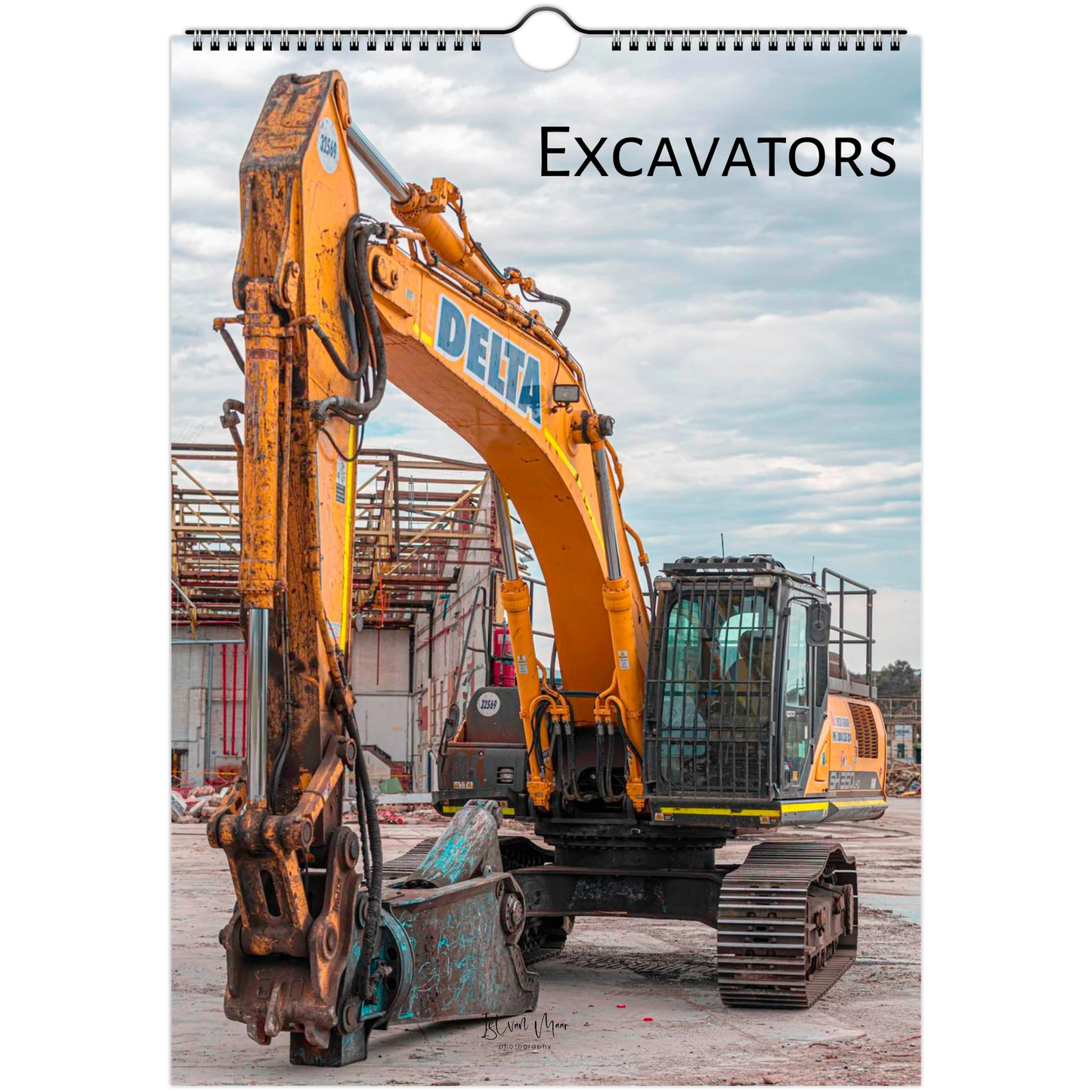 A spiral-bound wall calendar page featuring a large photograph of a yellow Delta excavator at a construction site, with the word 'Excavators' printed at the top.