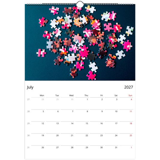 2027 Puzzle Wall Calendar – product packaging and spiral binding detail
