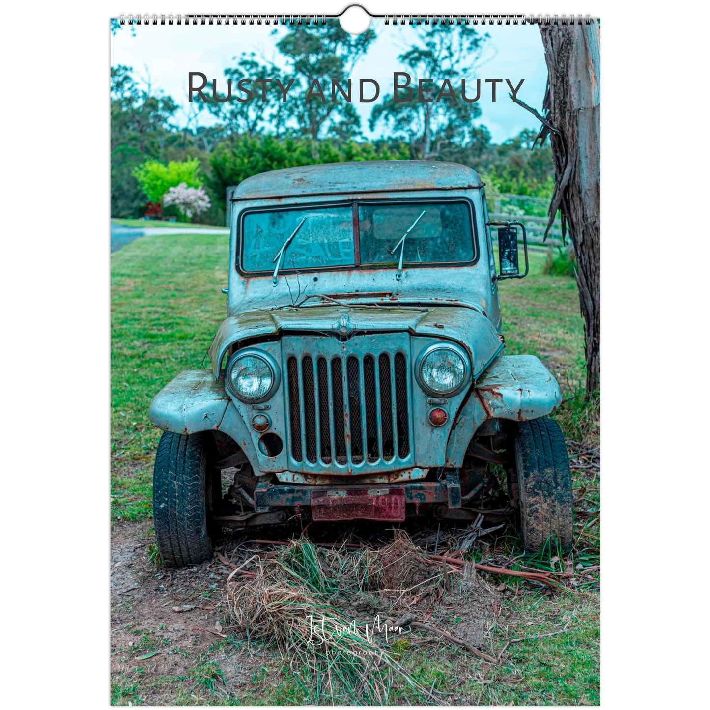 Calendar cover featuring an old, rusted jeep in a natural setting with the title 'Rusty and Beauty'.