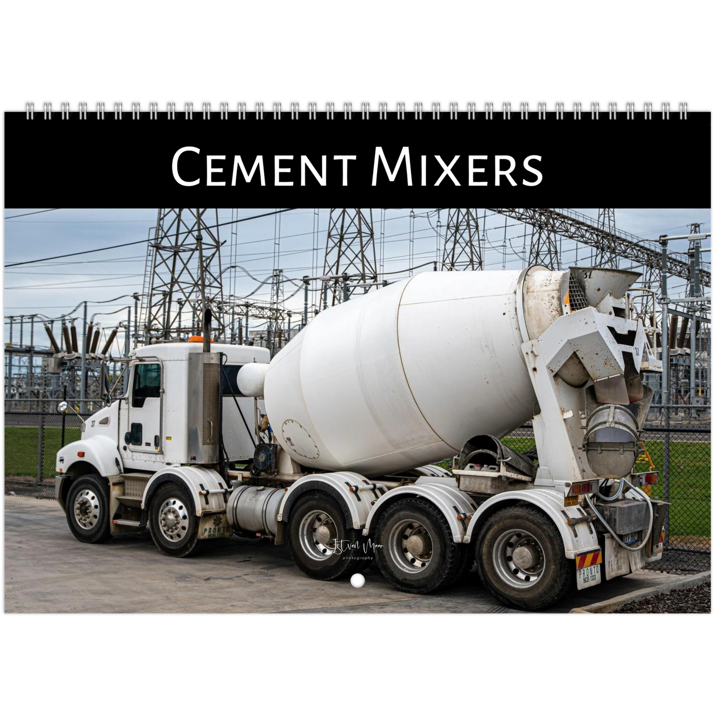 Cement mixer truck with power lines in the background