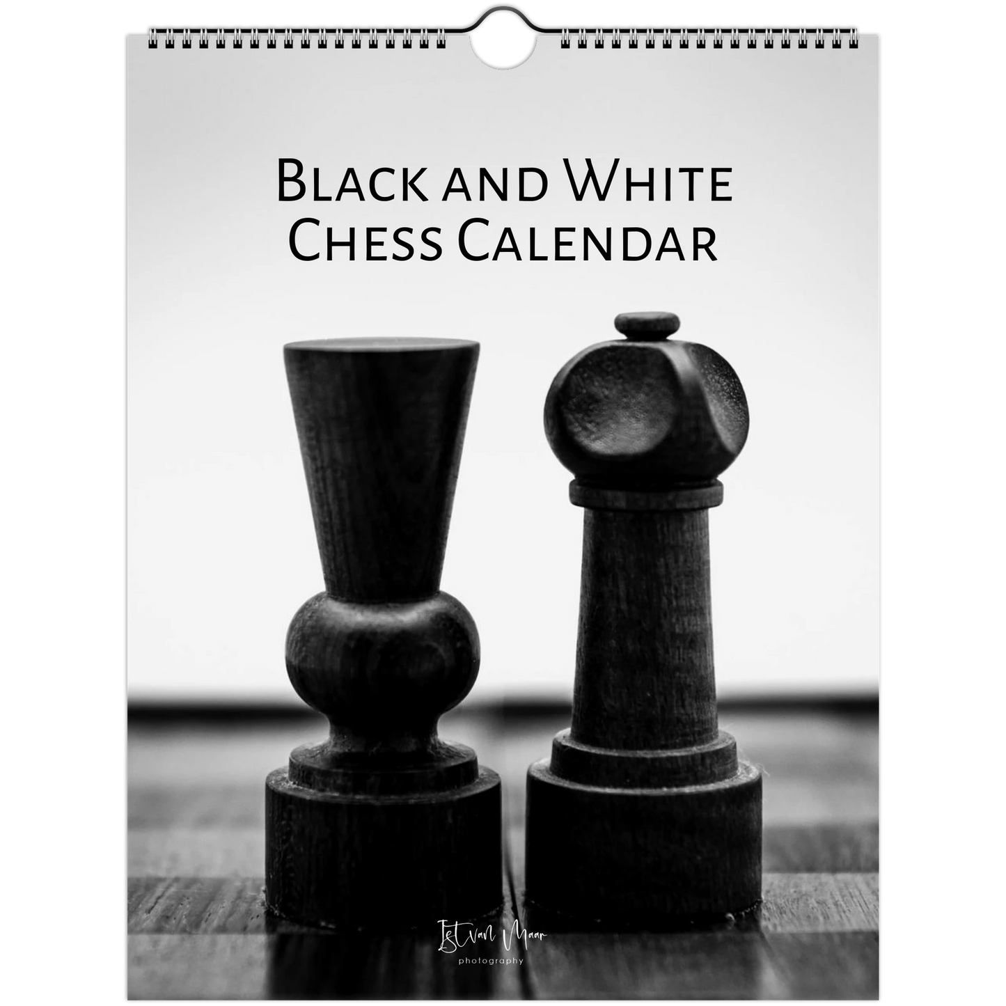 A spiral-bound wall calendar cover featuring a black-and-white photograph of two chess pieces on a table, with the text 'BLACK AND WHITE CHESS CALENDAR' at the top.
