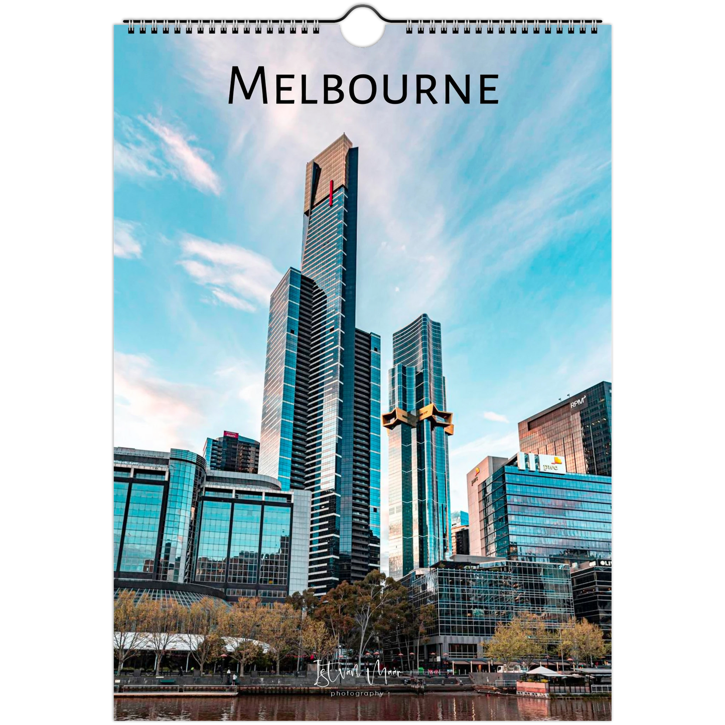 A spiral-bound wall calendar page featuring a photograph of Melbourne's skyline with the word 'MELBOURNE' printed at the top, shown against a plain white background.
