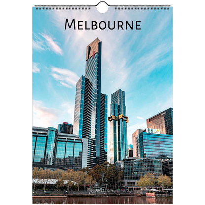 A spiral-bound wall calendar page featuring a photograph of Melbourne's skyline with the word 'MELBOURNE' printed at the top, shown against a plain white background.