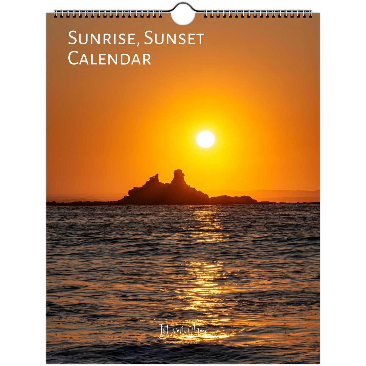 A spiral-bound wall calendar cover featuring a sunset over the ocean with a rocky island silhouette. The title 'SUNRISE, SUNSET CALENDAR' appears at the top in white text, and a small signature or brand mark is visible near the bottom. Available in A4, A3, LT and LG US sizes. Shipping worldwide.