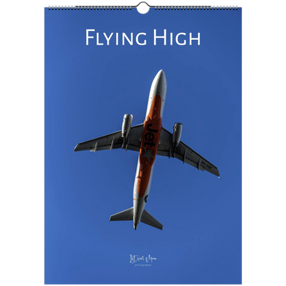 Calendar cover with an airplane and 'Flying High' text against a blue sky. Istvan Maar Photography, personalisable aviation wall calendar