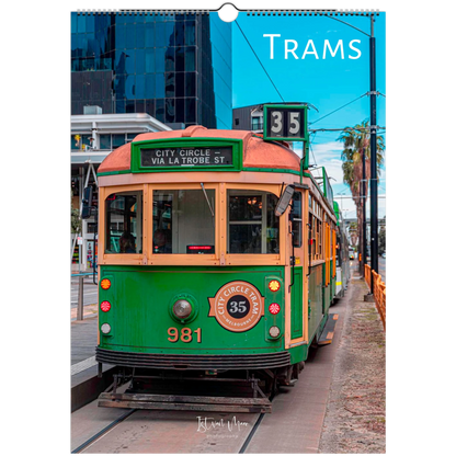 A hanging wall calendar page featuring a vintage green and cream tram on a city street, with the word 'TRAMS' printed at the top and a small circular 'Klippan' mark near the bottom.