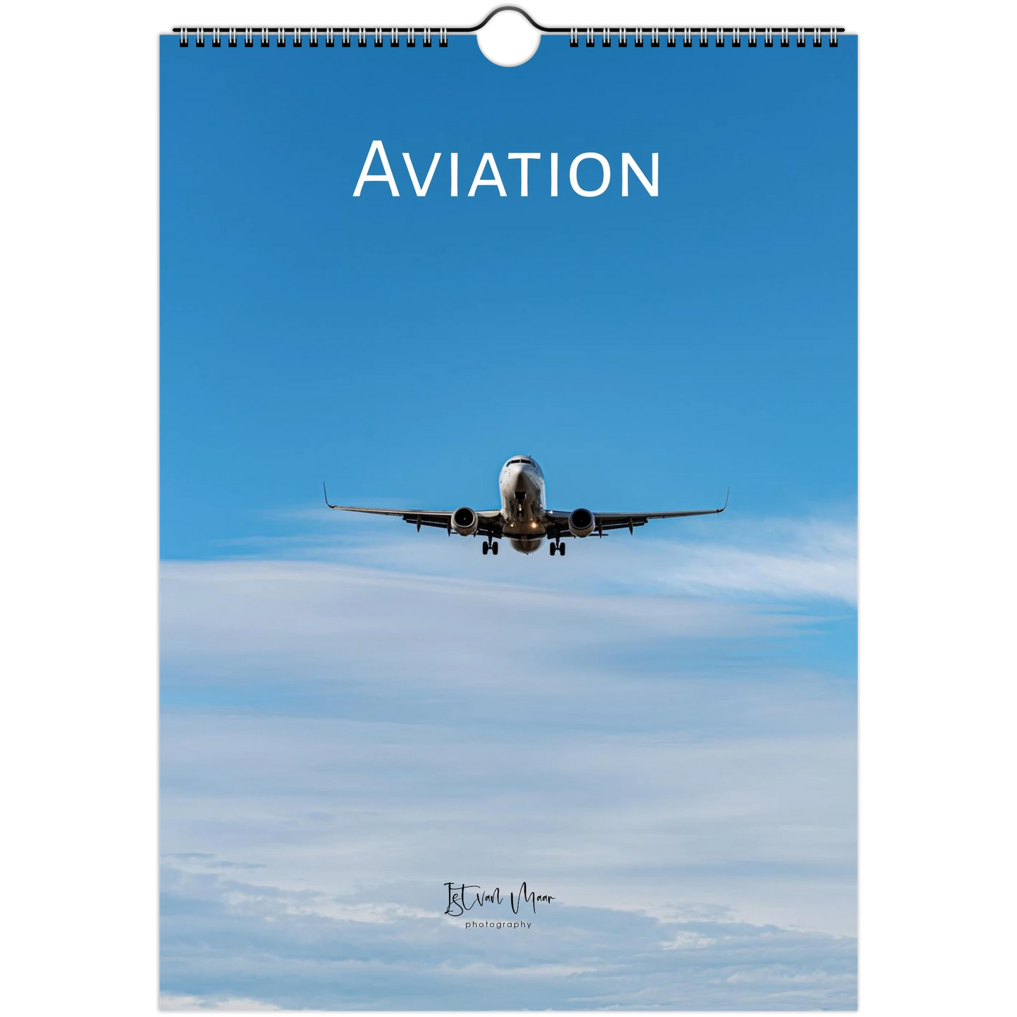 A spiral-bound wall calendar featuring an aviation theme, with a blue sky background, an airplane flying overhead, and the word 'AVIATION' printed at the top.