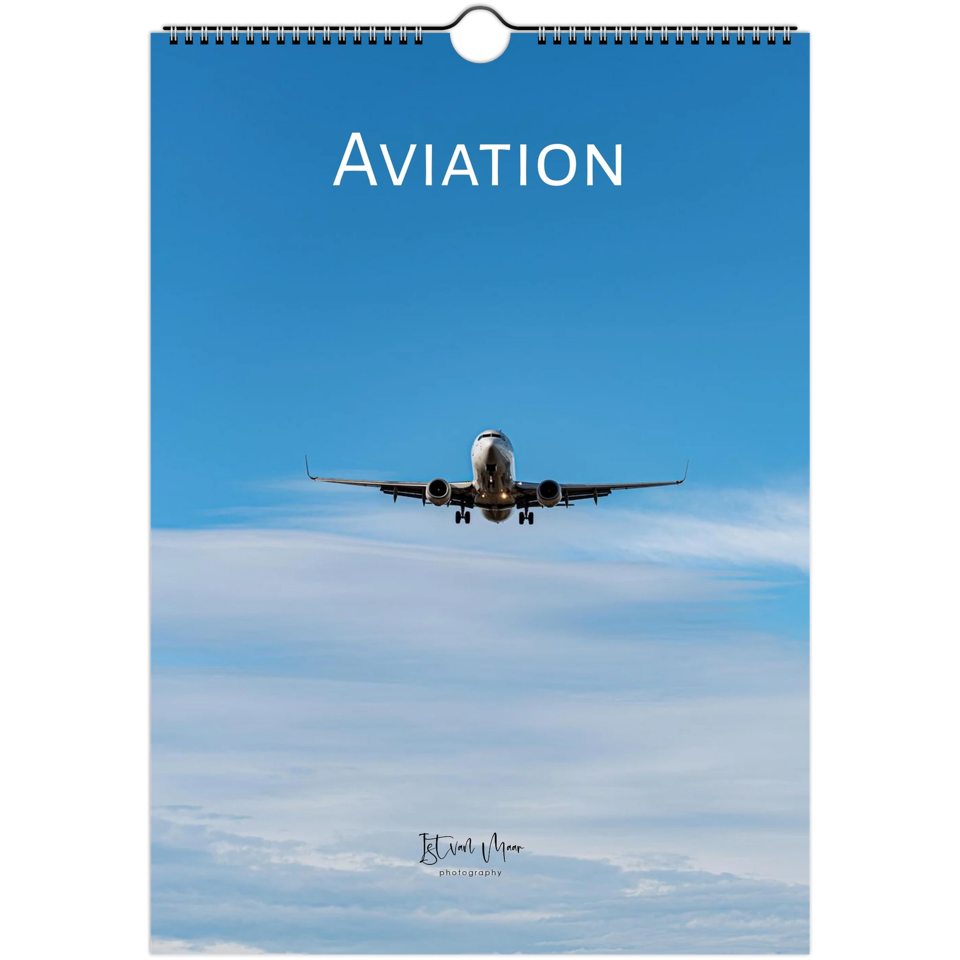 A spiral-bound wall calendar featuring an aviation theme, with a blue sky background, an airplane flying overhead, and the word 'AVIATION' printed at the top.