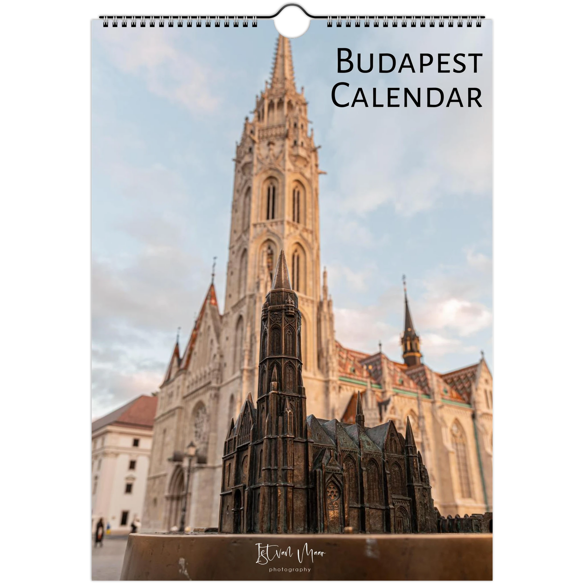 A hanging wall calendar cover featuring a photograph of the Budapest cathedral and a small architectural model in the foreground, with the text 'BUDAPEST CALENDAR' at the top right.