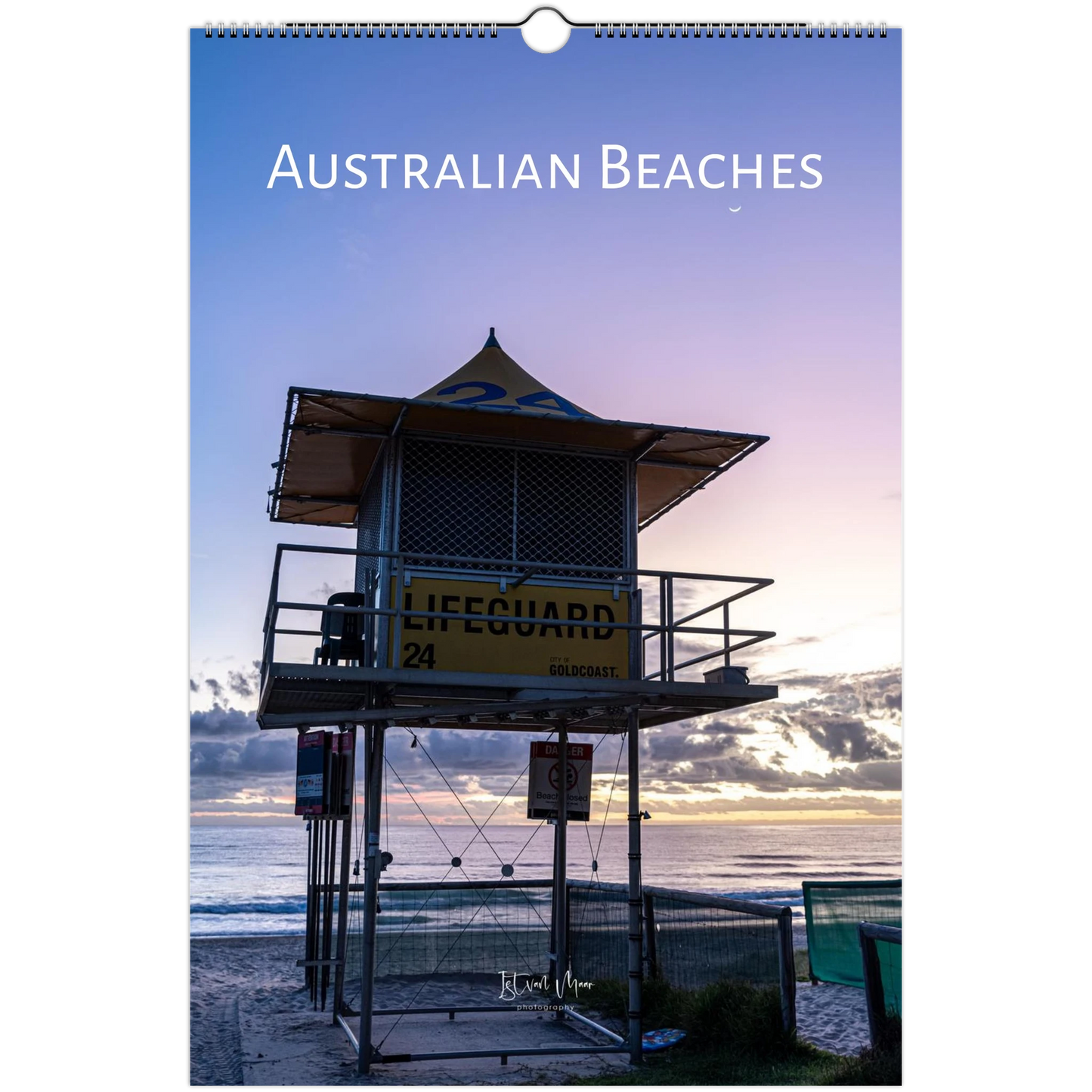 A vertical wall calendar or print titled "AUSTRALIAN BEACHES" showing a beach lifeguard tower at sunrise over the ocean, with a spiral binding visible at the top. Calendar is available in A4, A3, LT and Ledger US sizes.