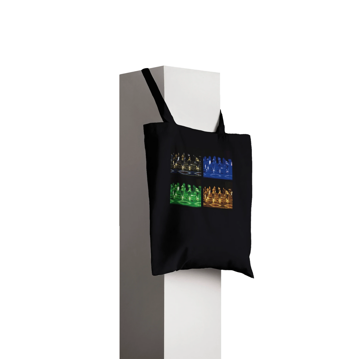 Black tote bag with white text and logo on a white background