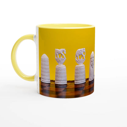 A yellow ceramic mug featuring a printed graphic of white Egyptian papyrus pincushion cups on a wooden surface against a yellow background.