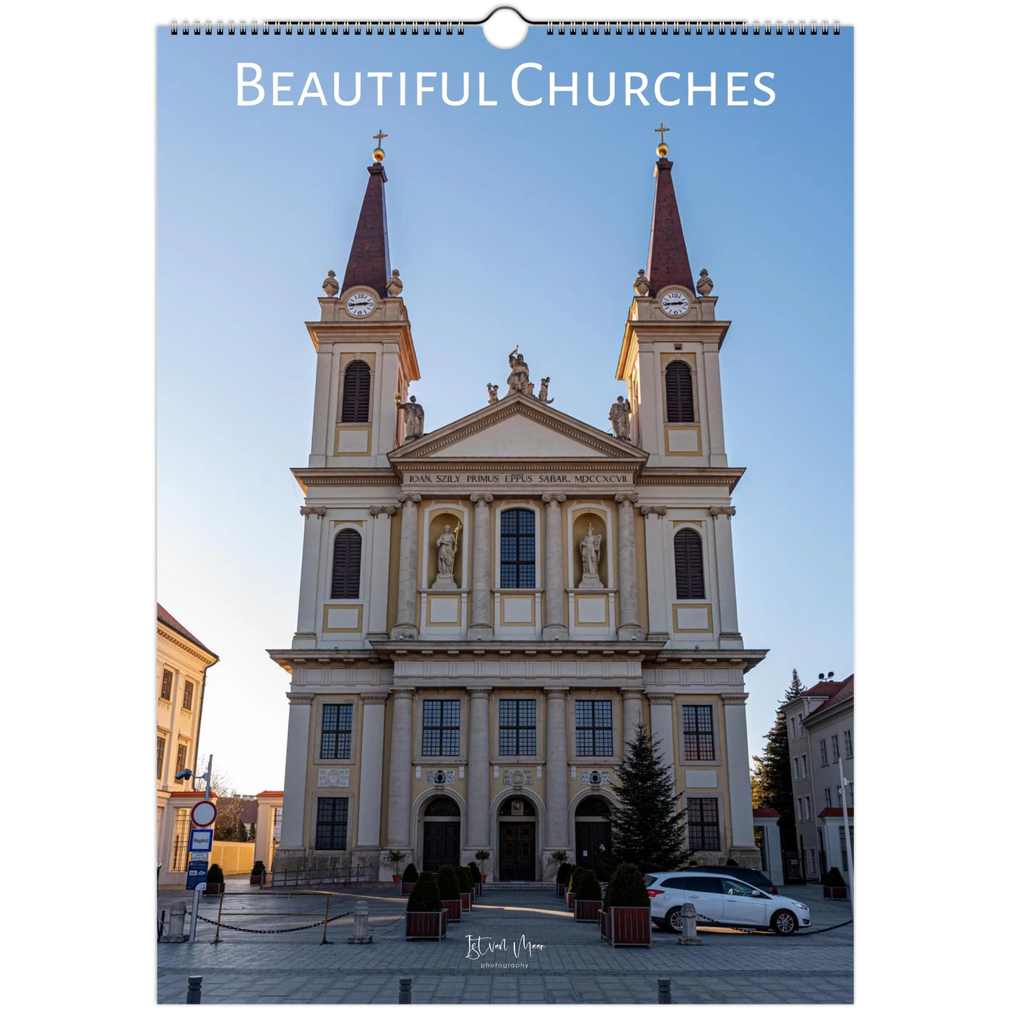 Calendar cover featuring a large church with two towers against a blue sky.