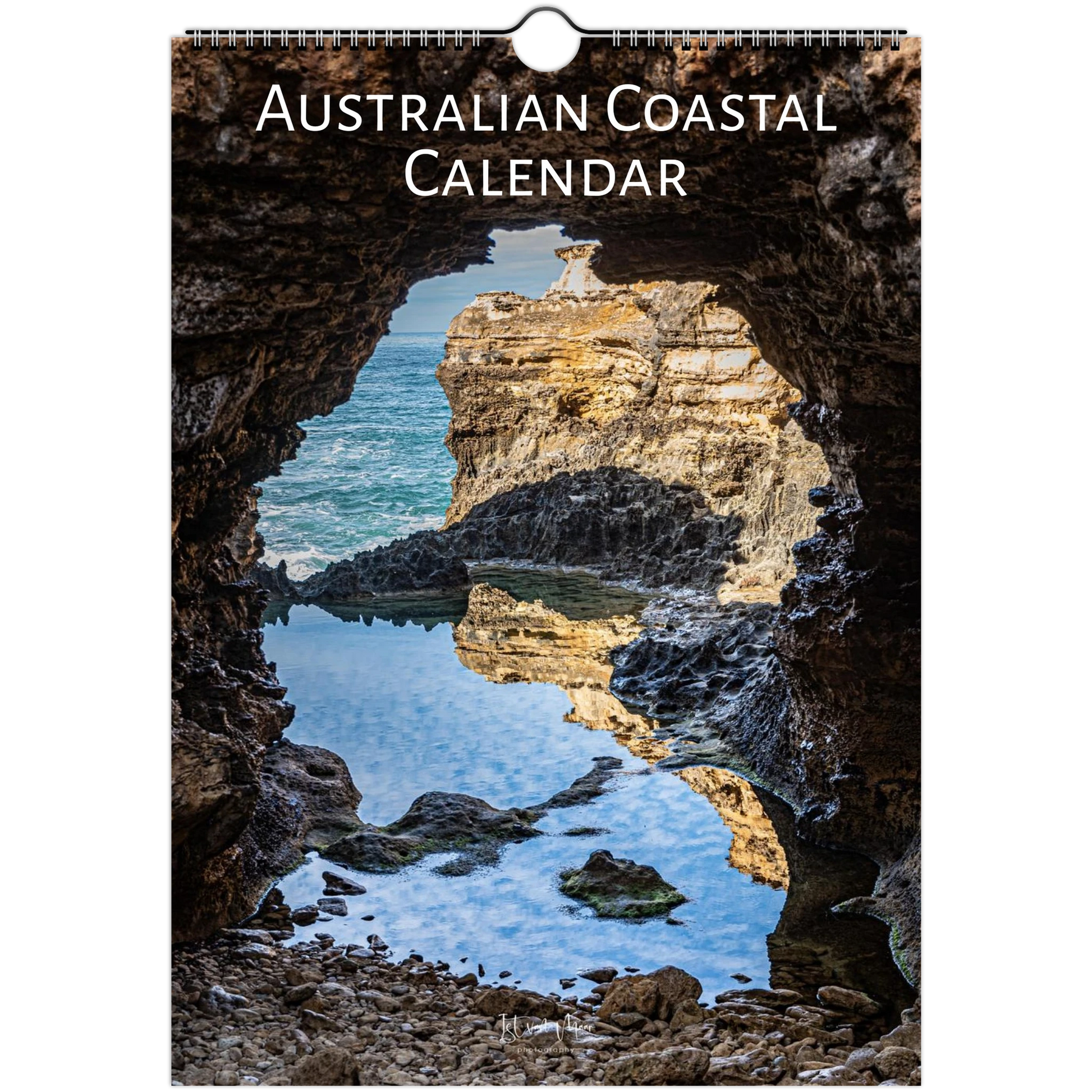 Australian Coastal Calendar featuring a scenic photograph of a rocky coastal cave opening onto blue water and sunlit cliffs, with the title 'AUSTRALIAN COASTAL CALENDAR' printed at the top.