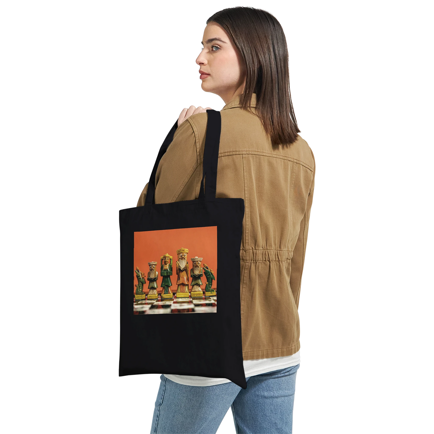 Woman carrying black canvas chess tote bag – personalised hand painted chess set design by Istvan Maar Photography