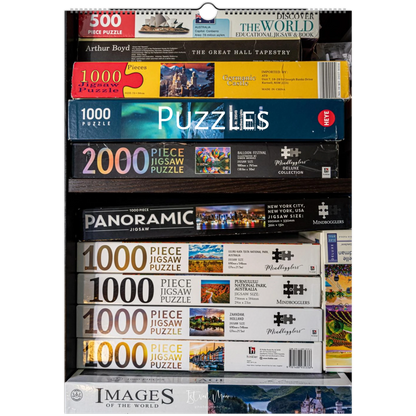 Collection of various puzzle boxes with titles and images on a white background