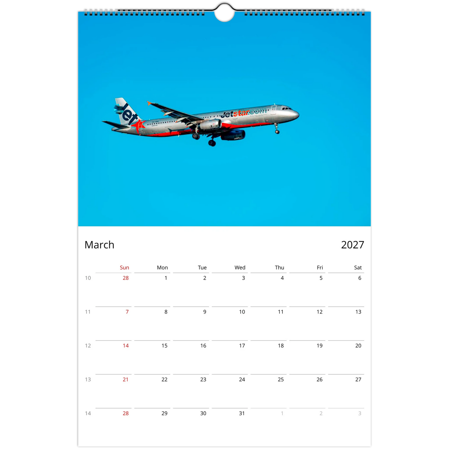 A single-page wall calendar page showing March 2027, with a large blue header containing a JetBlue airplane photo and a white calendar grid below.