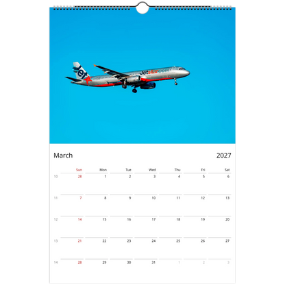 A single-page wall calendar page showing March 2027, with a large blue header containing a JetBlue airplane photo and a white calendar grid below.