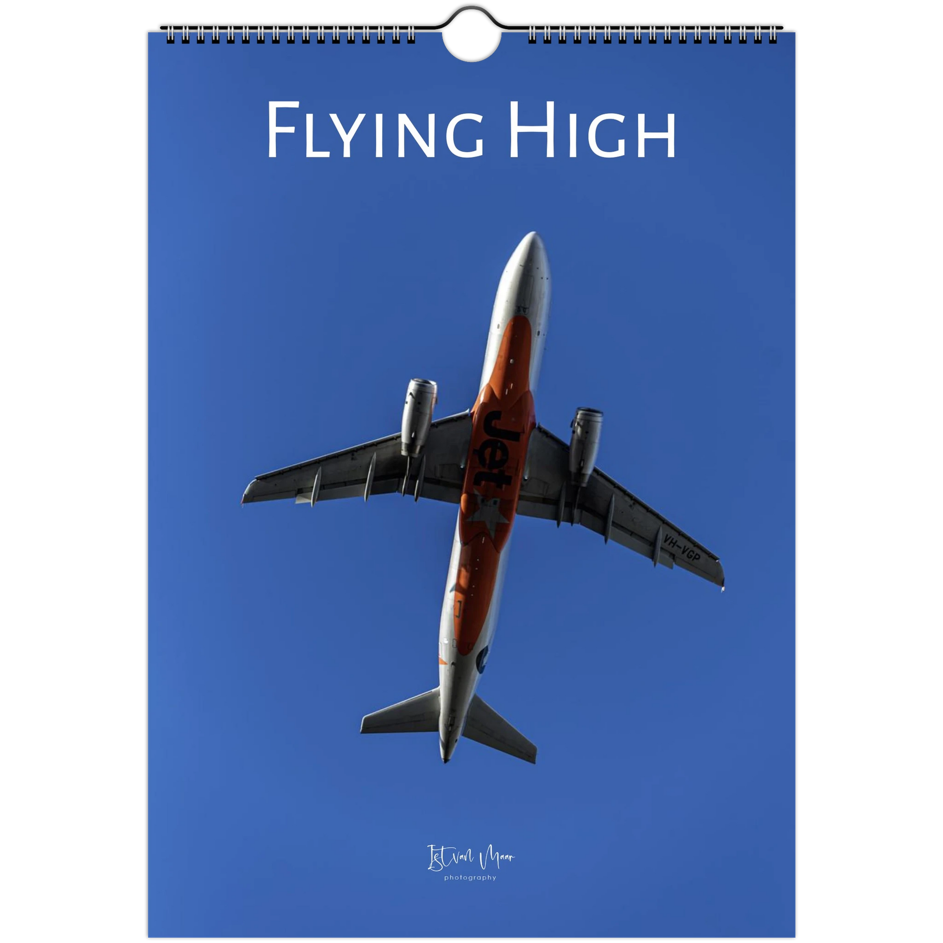 Calendar cover with an airplane and 'Flying High' text on a blue background