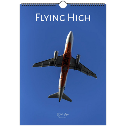 Calendar cover with an airplane and 'Flying High' text on a blue background
