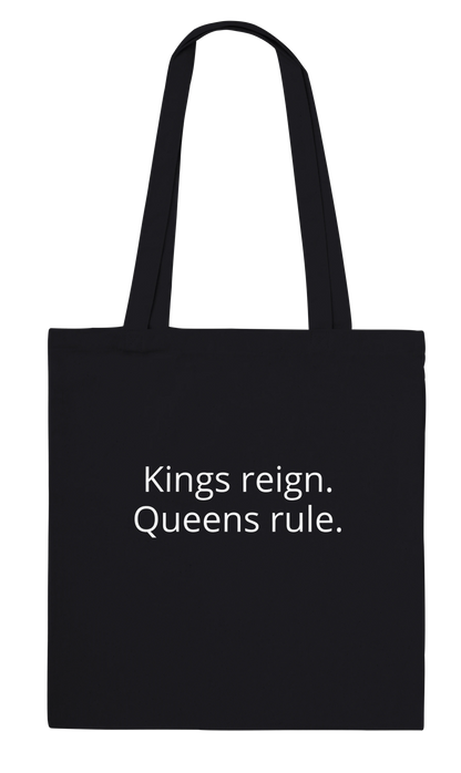Back of Bronze Chess Set Tote Bag Black Classic – Kings reign. Queens rule. printed in white font