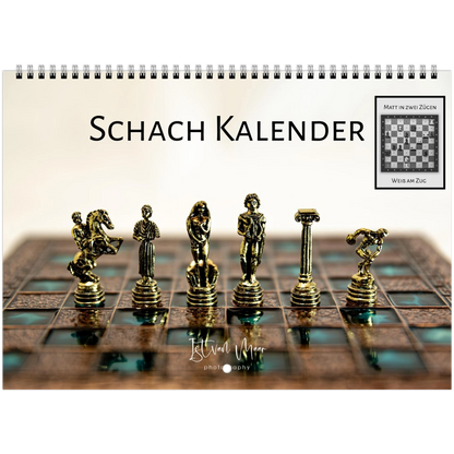 Schach Kalender wall calendar cover featuring a spiral wire binding, with the German title 'Schach Kalender' and a chessboard scene showing metallic gold chess pieces on a brown board. A small inset in the top right shows a chess puzzle labeled 'MATT IN ZWEI ZUGEN' and 'WISSEN ZUG'.