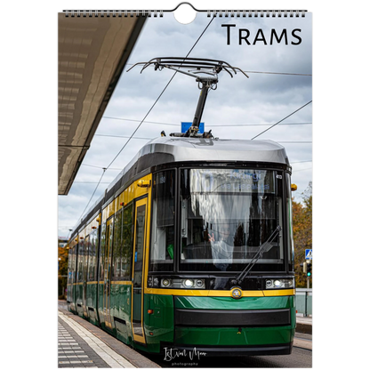 A spiral-bound wall calendar or print featuring a photograph of a green and yellow tram at a station platform under an overcast sky, with the word "TRAMS" printed at the top. Available in A4, A3, LT and LG US sizes.