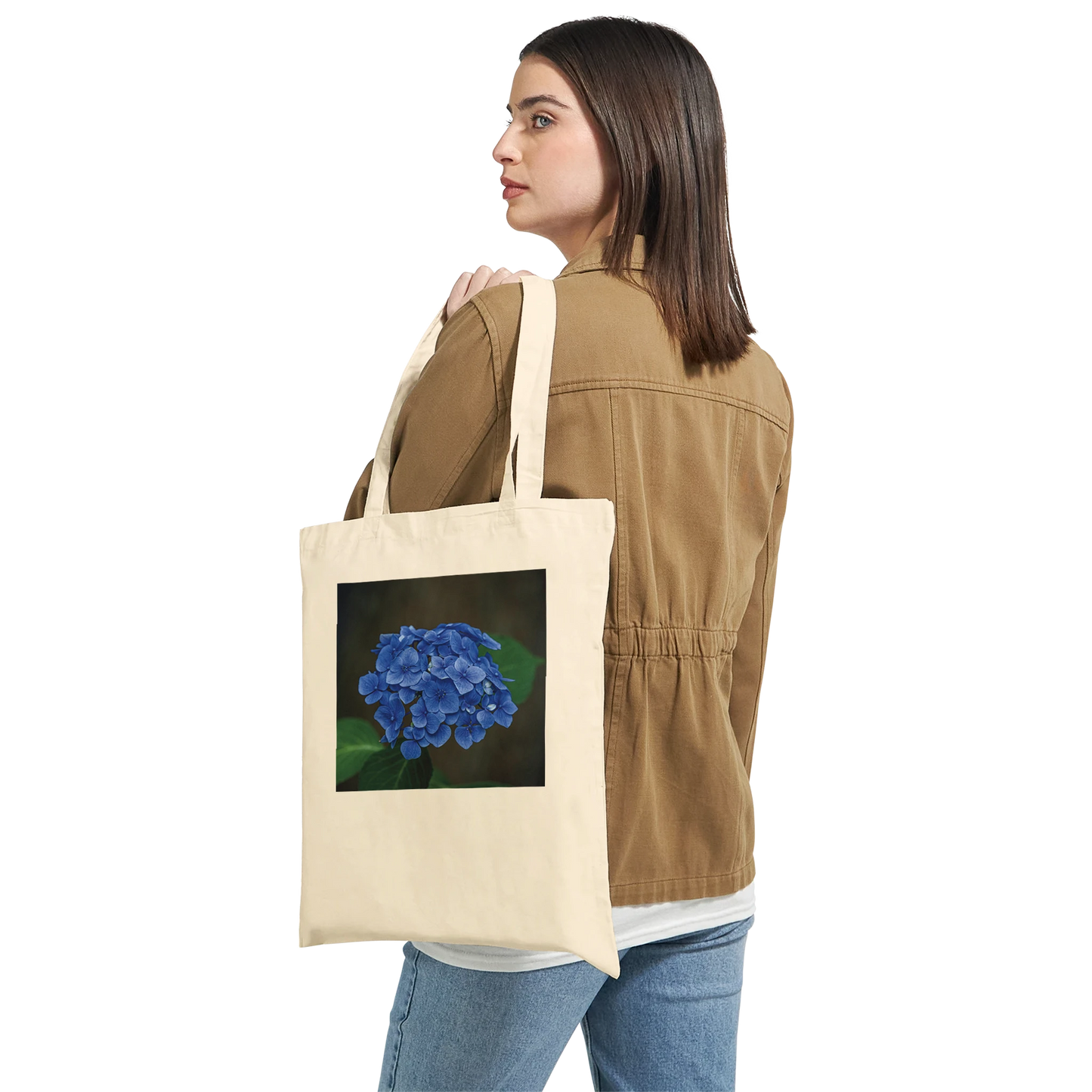 Model carrying a natural canvas tote bag printed with a blue hydrangea photograph, Classic style