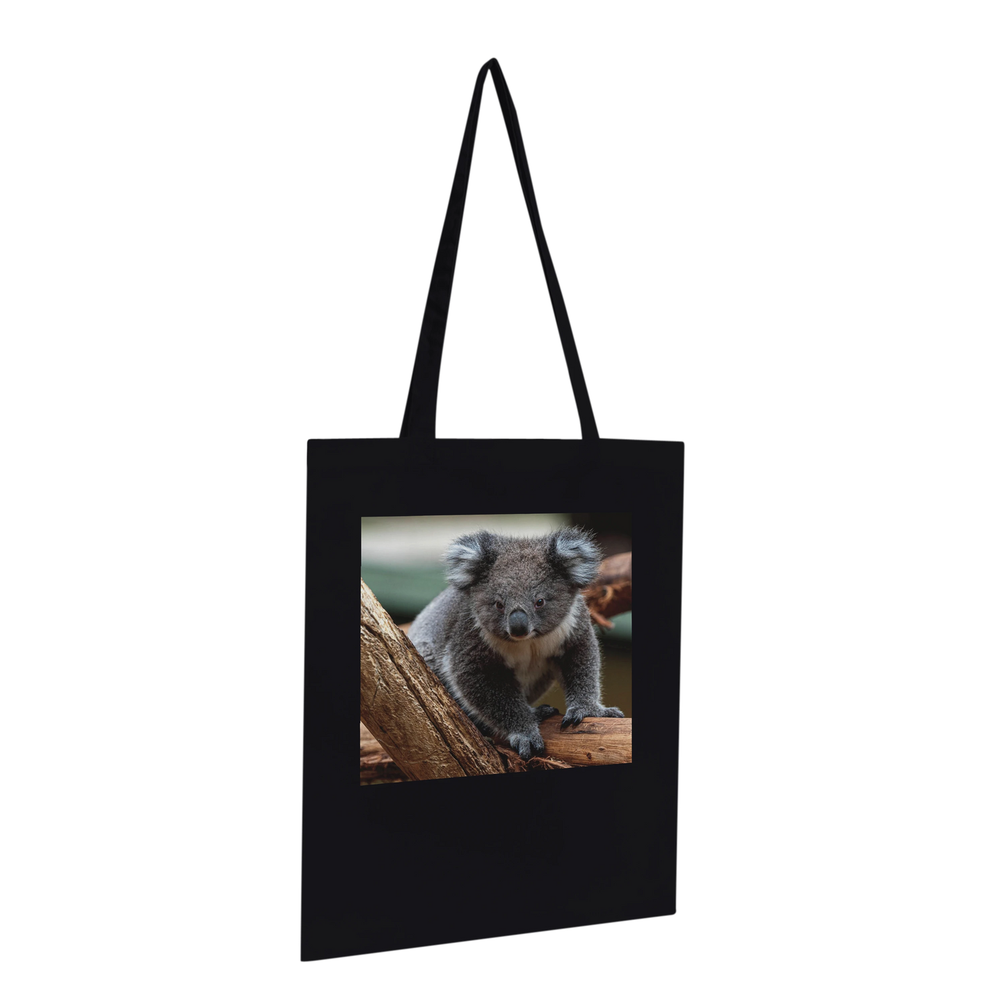 Black canvas tote bag printed with a koala photograph, Premium style, hanging profile view