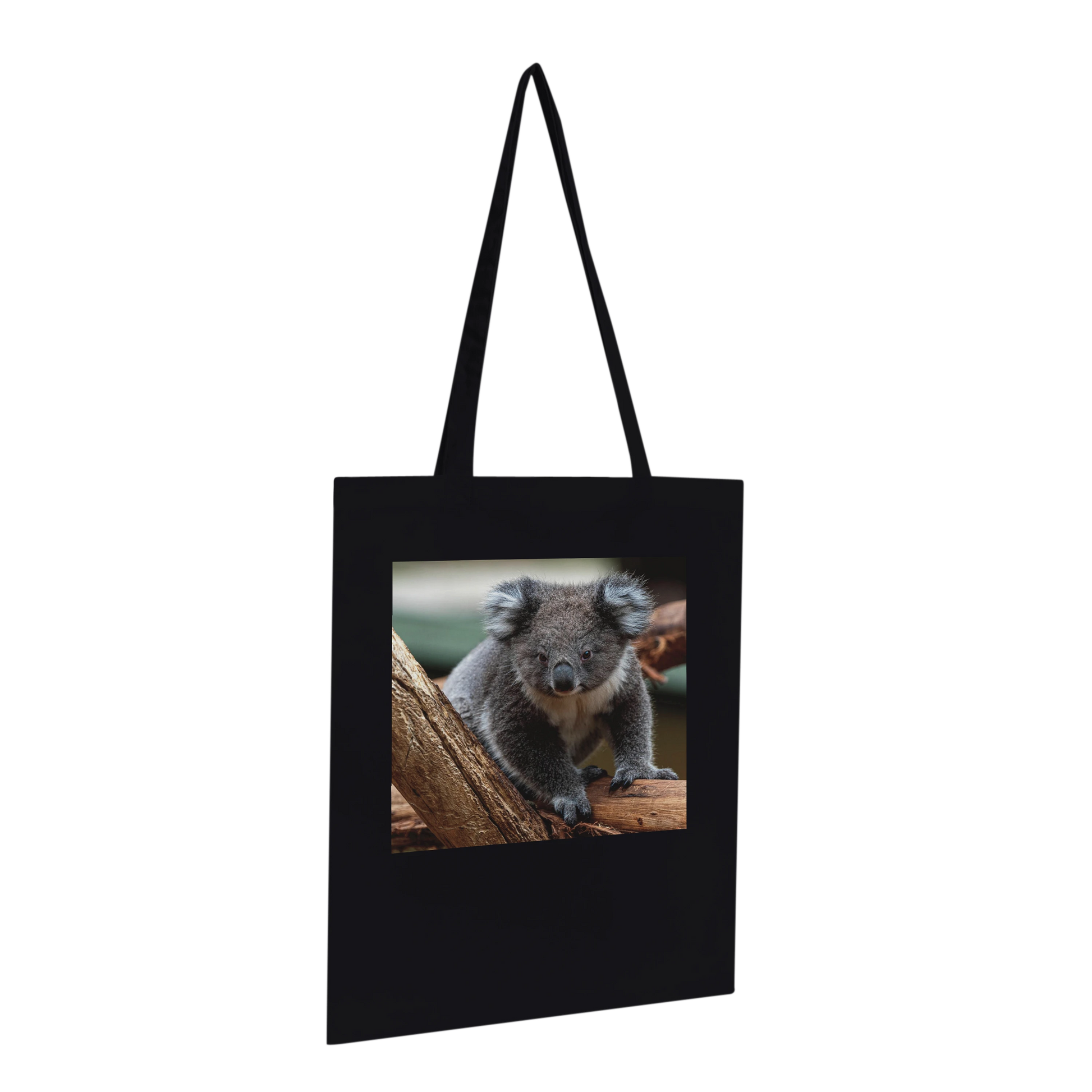 Black canvas tote bag printed with a koala photograph, Premium style, hanging profile view