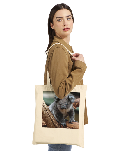 Model carrying a natural canvas tote bag printed with a koala photograph, Premium style