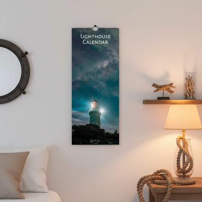 Lighthouse calendar hanging on a wall with decorative elements like a lamp and shelf.