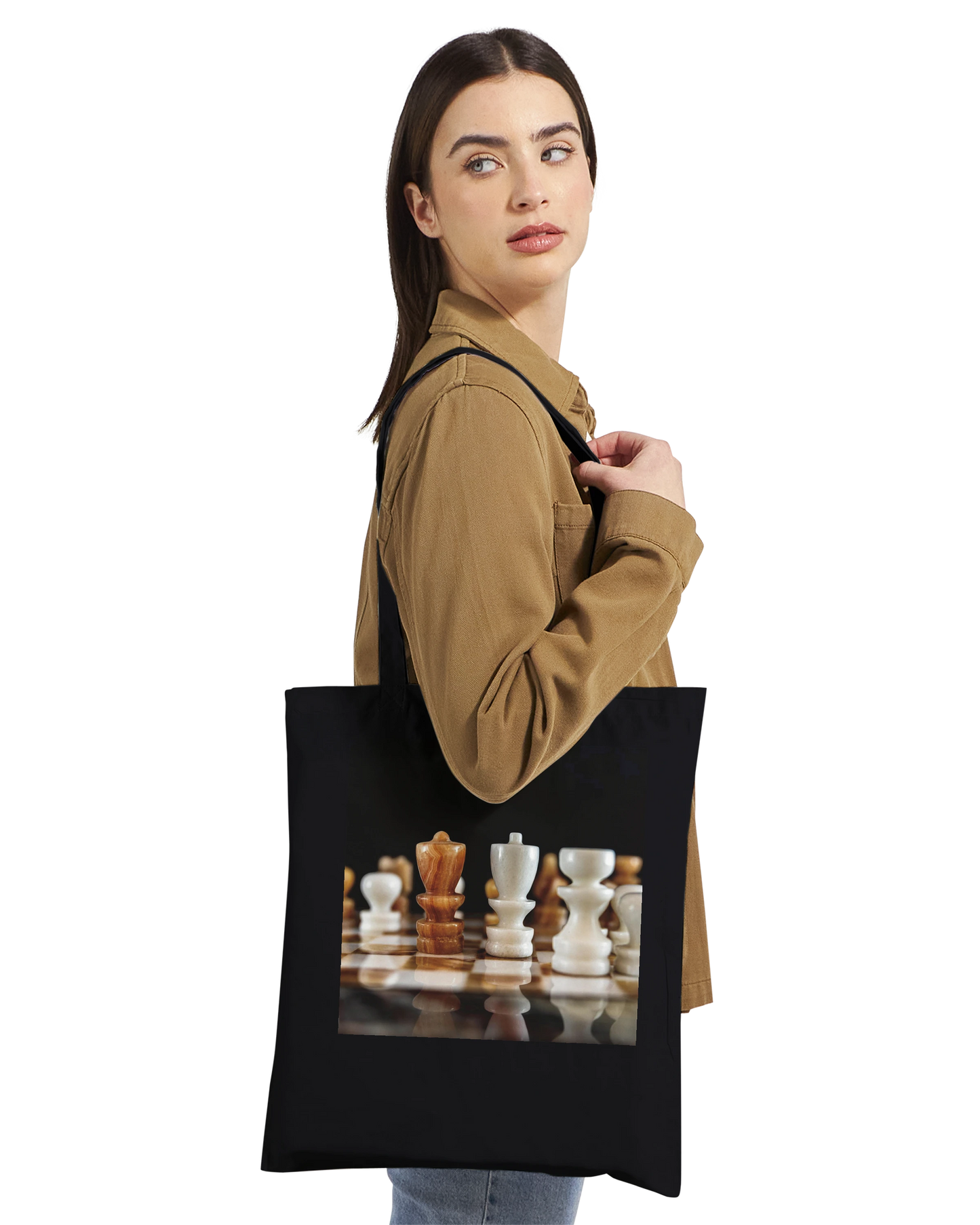 Woman carrying The King Stands Alone chess tote bag — Premium Natural