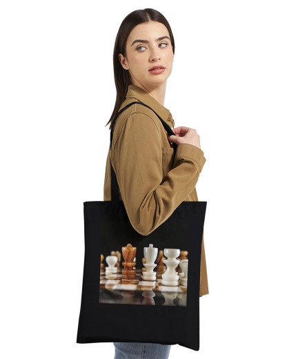 Woman carrying The King Stands Alone chess tote bag — Premium Natural