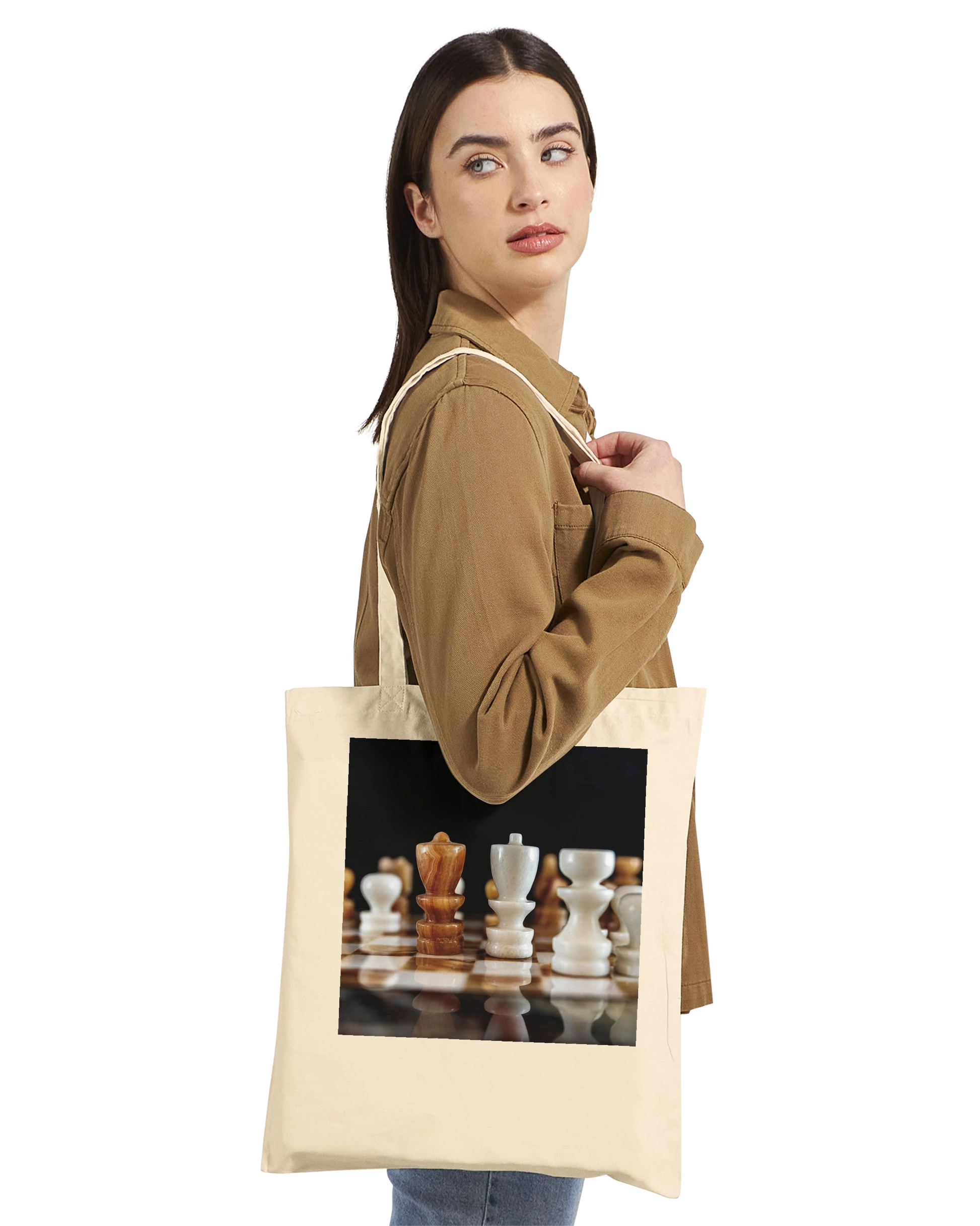 Woman carrying The King Stands Alone chess tote bag — Premium Natural