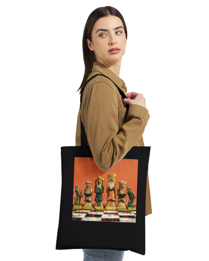 Woman wearing black premium chess tote bag – editorial lifestyle shot of personalised hand painted chess gift