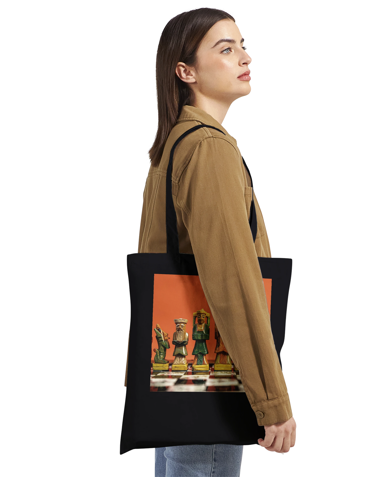 Woman carrying black premium chess tote bag side view – personalised hand painted chess set design by Istvan Maar Photography