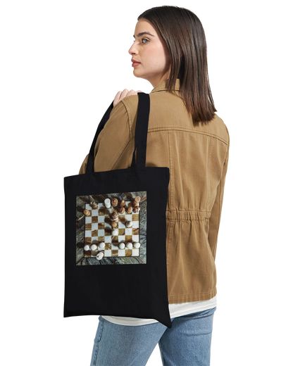 Woman carrying Carved from the Earth marble chess tote bag — Premium Black