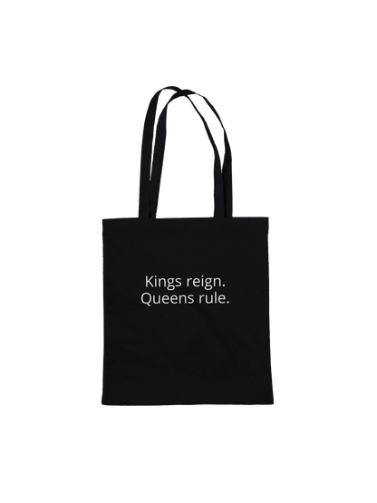 Back of Bronze Chess Set Tote Bag Black Premium – Kings reign. Queens rule. chess motto in white