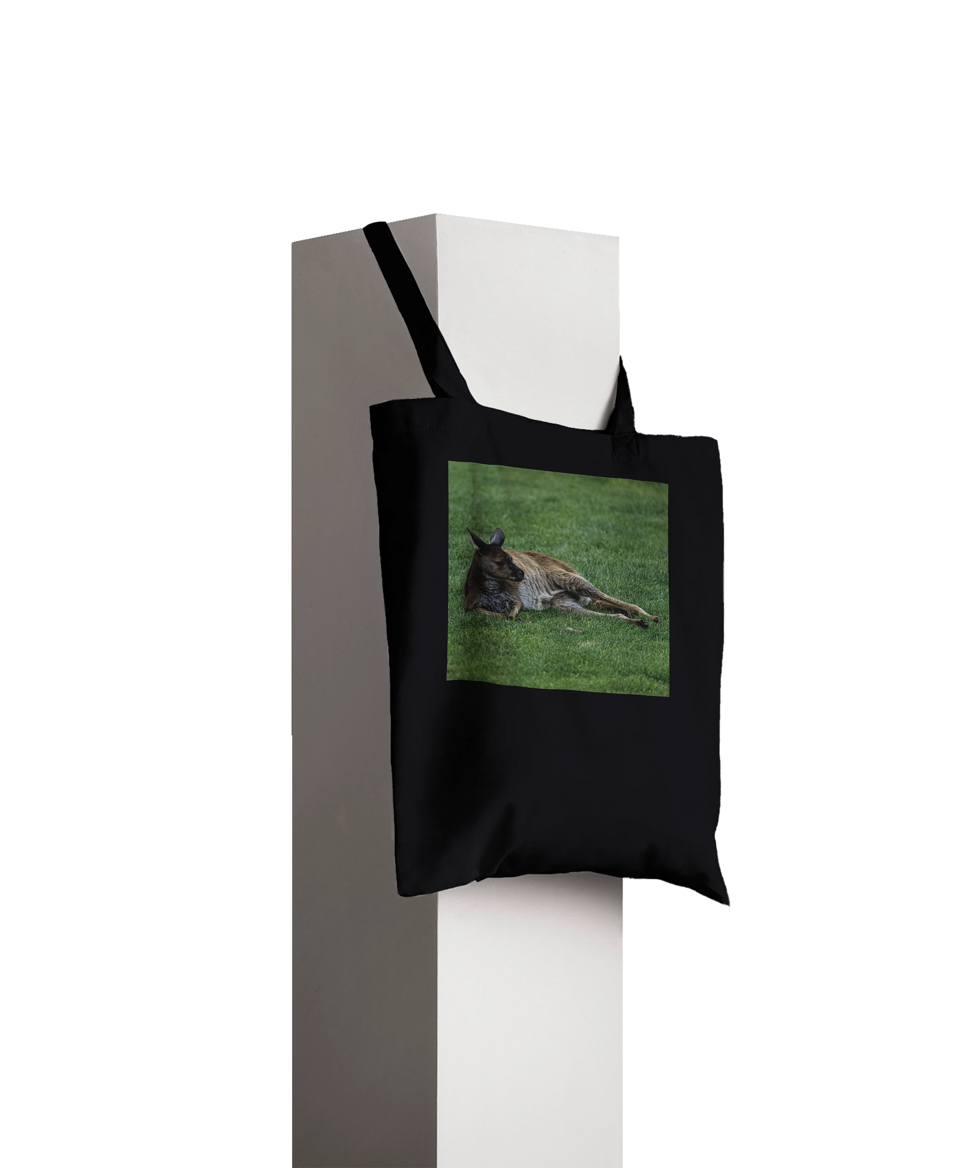 Premium black kangaroo tote bag displayed on pillar – personalised Australian wildlife gift tote