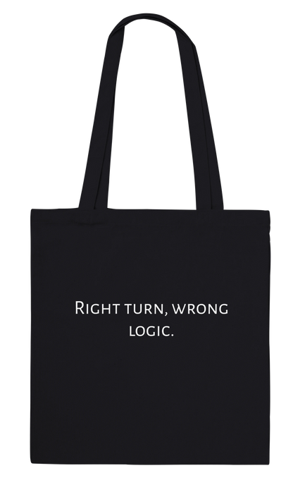 Back of Classic Black canvas tote bag personalised with the text 'Right turn, wrong logic.' in white